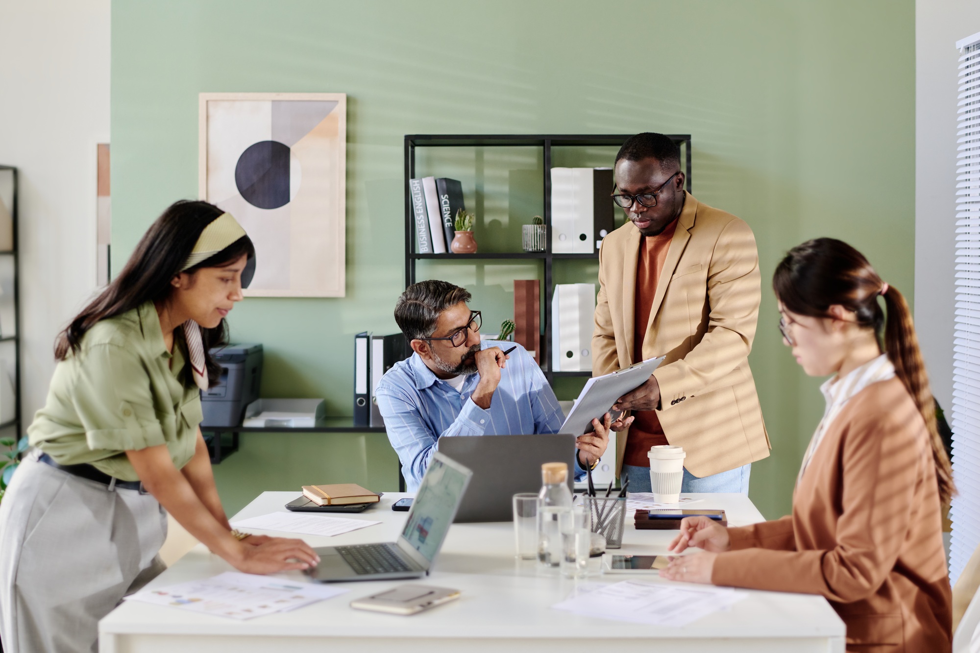 Collaborating Team Engaging in Discussion at Office